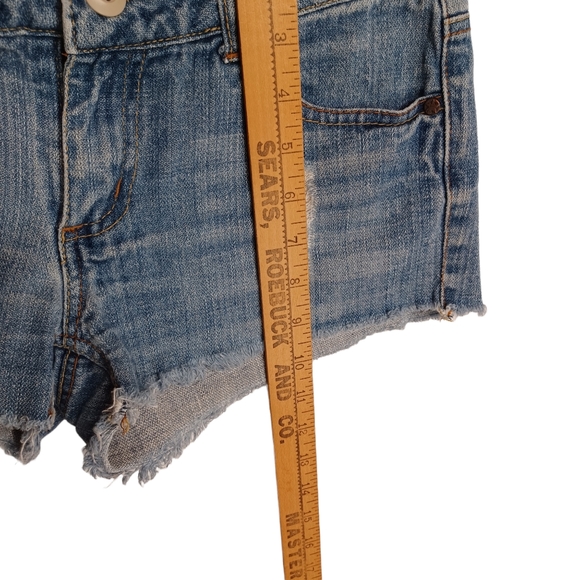 SOMETHING TRICKIE FREE THE REVOLUTION Light Wash Distressed Mini Raw Hem Shorts - Picture 5 of 5